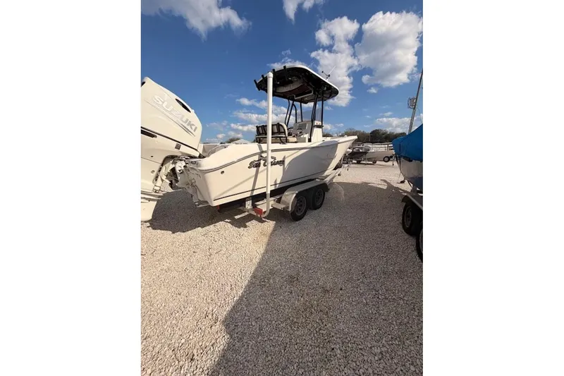 Slide: The Image of 2019 Sea Chaser 24 HFC boat on trailer under blue sky. - 2