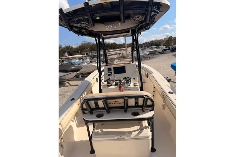Slide: The Image of 2019 Sea Chaser 24 HFC boat interior with steering console and seating. - 5