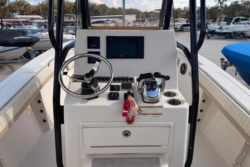 Slide: The Image of 2019 Sea Chaser 24 HFC boat console with steering wheel and navigation controls. - 6