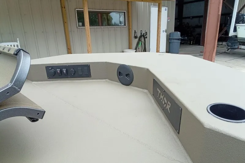 Slide: The Image of 2027 Thor 1900 Bay Hammer boat deck with control panel and seating area. - 32