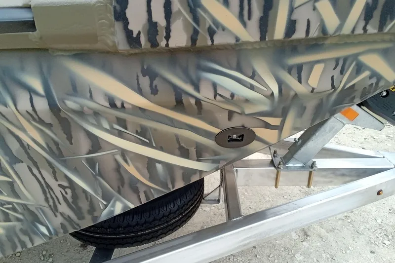 Slide: The Image of Camouflage-patterned 2027 Thor 1900 Bay Hammer boat on a trailer. - 34
