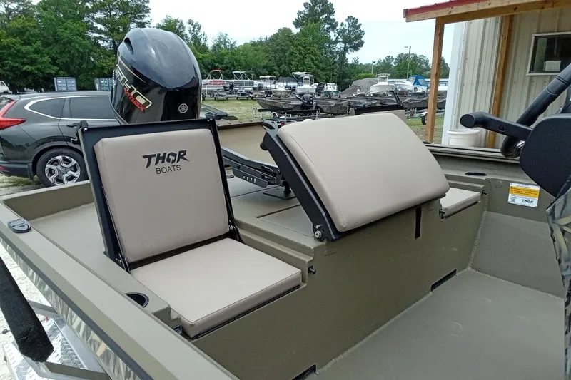 Slide: The Image of 2027 Thor 1900 Bay Hammer boat with beige seats and Yamaha motor. - 36
