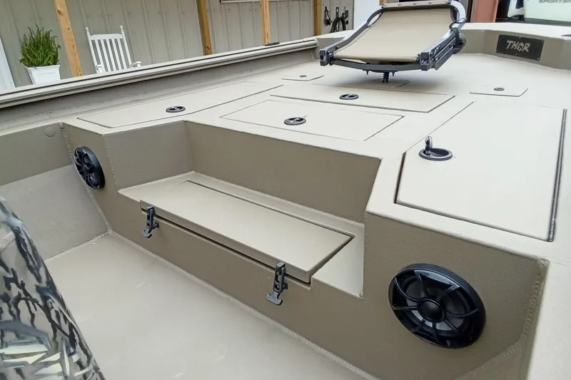 Slide: The Image of Interior of 2027 Thor 1900 Bay Hammer boat with seating and storage compartments. - 37