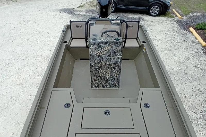 Slide: The Image of 2027 Thor 1900 Bay Hammer boat interior with camouflage console and seating. - 46