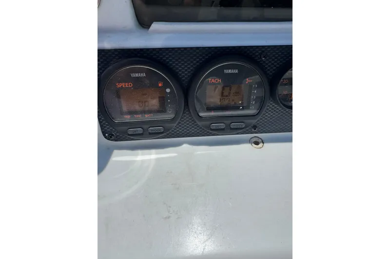 Slide: The Image of Dashboard of a 2004 Triumph 210 CC boat with Yamaha gauges. - 13