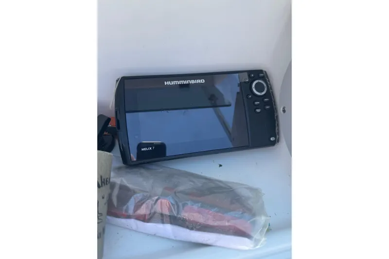 Slide: The Image of Humminbird Helix 7 fish finder on 2004 Triumph 210 CC boat. - 16
