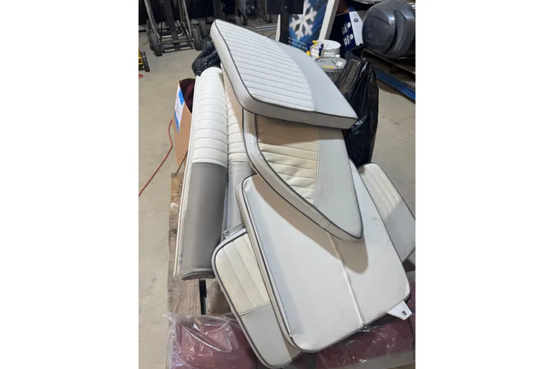 Slide: The Image of 2004 Triumph 210 CC boat seats in a workshop setting. - 17