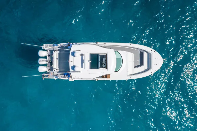 Slide: The Image of Manufacturer Provided Image: Aerial view of 2026 Regal 38 SAV yacht on clear blue water. - 4