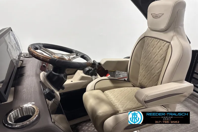 Slide: The Image of Luxurious helm seat and steering wheel of 2026 Bennington 24 MSB boat. - 2