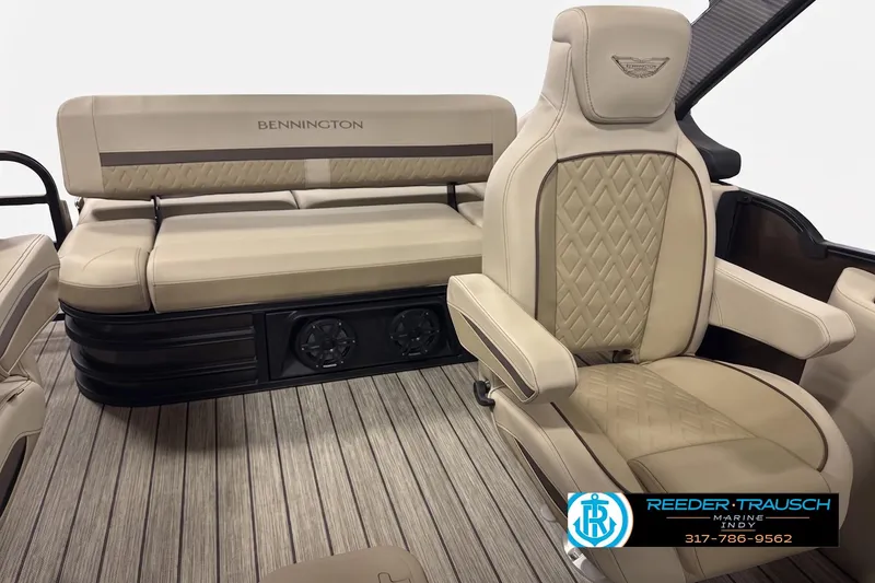 Slide: The Image of Luxurious interior of 2026 Bennington 24 MSB pontoon boat with beige seating. - 3