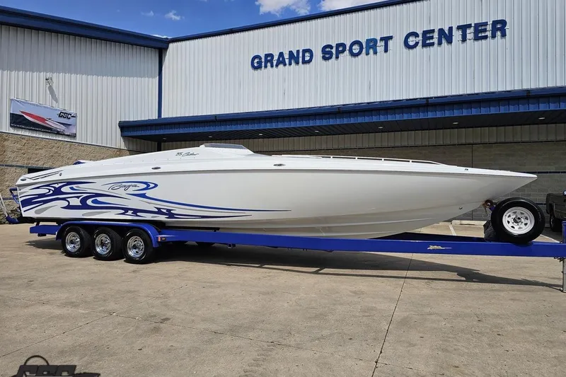 Slide: The Image of 2006 Baja 35 Outlaw boat on trailer at Grand Sport Center. - 13