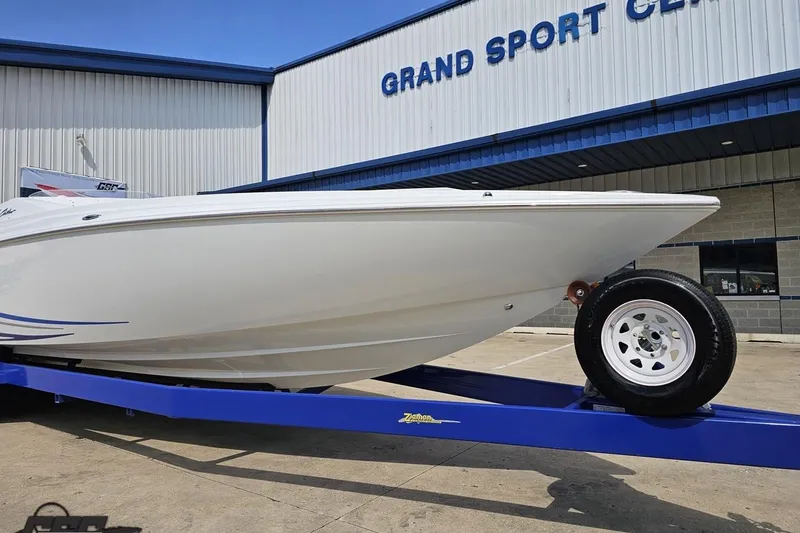 Slide: The Image of 2006 Baja 35 Outlaw boat on trailer at Grand Sport Center. - 14