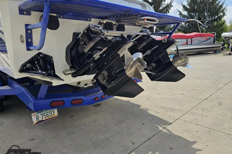 Slide: The Image of Rear view of a 2006 Baja 35 Outlaw boat with dual propellers. - 26