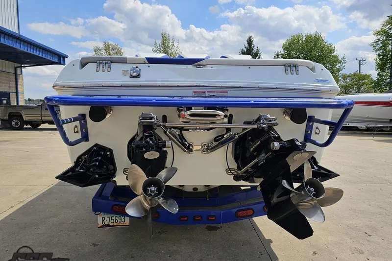 Slide: The Image of 2006 Baja 35 Outlaw boat rear view with dual propellers and blue accents. - 27
