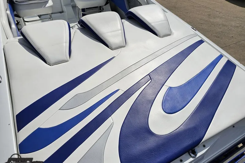 Slide: The Image of 2006 Baja 35 Outlaw boat interior with blue and white upholstery design. - 30