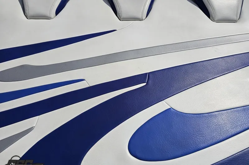 Slide: The Image of Blue and white upholstery design on a 2006 Baja 35 Outlaw boat. - 33