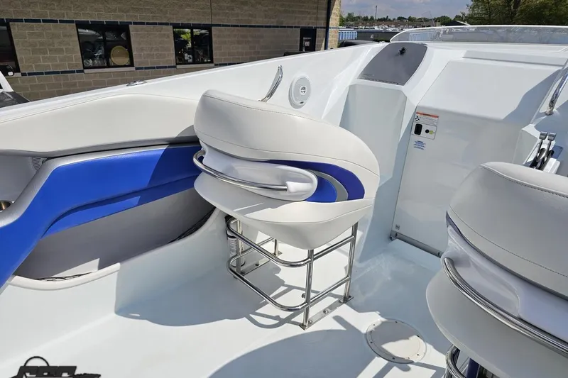 Slide: The Image of 2006 Baja 35 Outlaw boat interior with white and blue seating. - 43