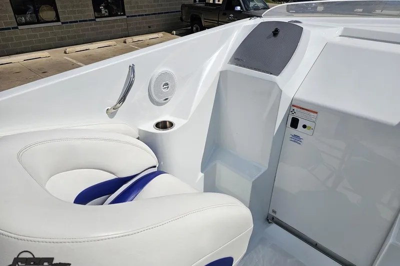 Slide: The Image of 2006 Baja 35 Outlaw boat interior with white seating and speaker. - 44