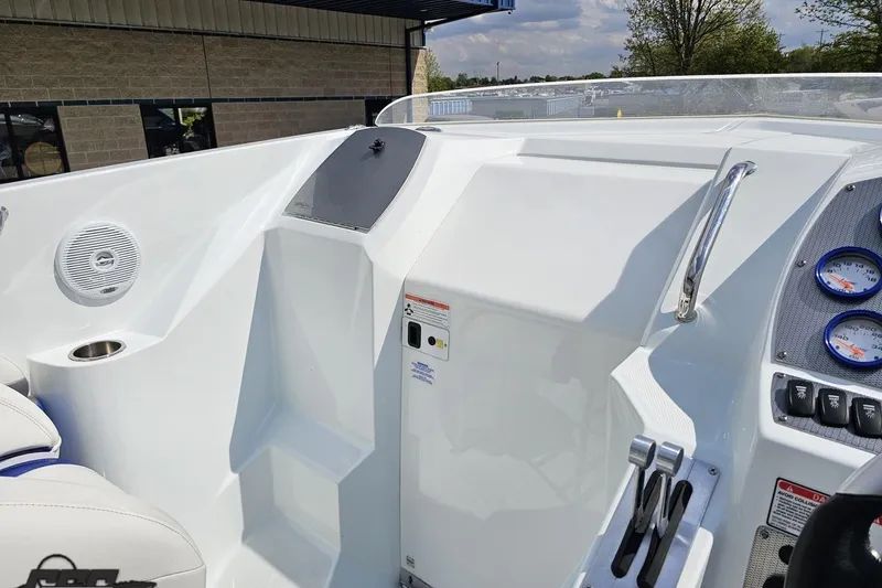 Slide: The Image of 2006 Baja 35 Outlaw boat cockpit with gauges and seating, showcasing sleek design. - 51