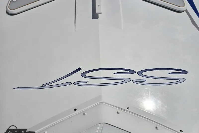 Slide: The Image of 2006 Baja 35 Outlaw boat with sleek design and "SS" logo on the hull. - 54