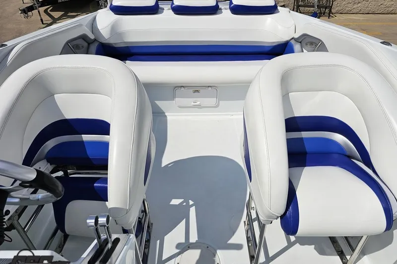 Slide: The Image of 2006 Baja 35 Outlaw boat interior with white and blue seating. - 59