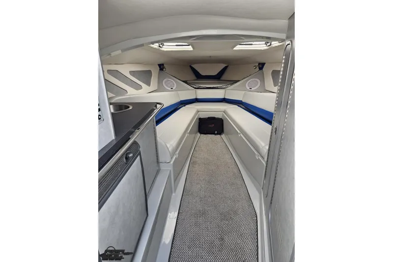 Slide: The Image of 2006 Baja 35 Outlaw cabin interior with seating, sink, and modern design elements. - 61