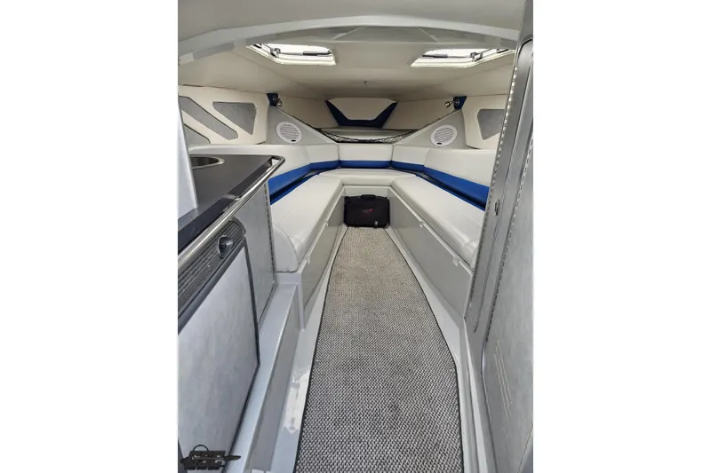 Slide: The Image of Interior of a 2006 Baja 35 Outlaw boat, featuring sleek seating and modern design. - 62