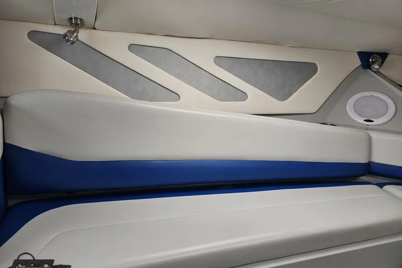 Slide: The Image of Interior of a 2006 Baja 35 Outlaw boat with blue and white seating. - 67
