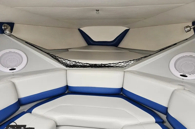 Slide: The Image of Interior of a 2006 Baja 35 Outlaw boat with blue and white seating. - 70