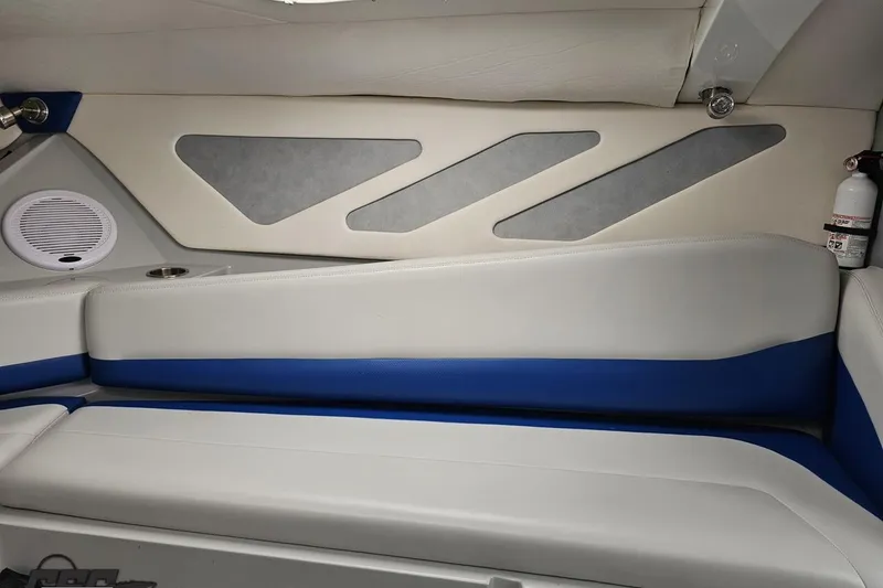 Slide: The Image of Interior of a 2006 Baja 35 Outlaw boat with blue and white seating. - 72