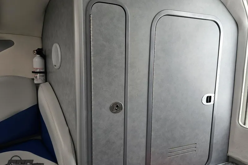 Slide: The Image of Interior cabin of a 2006 Baja 35 Outlaw boat with fire extinguisher. - 73