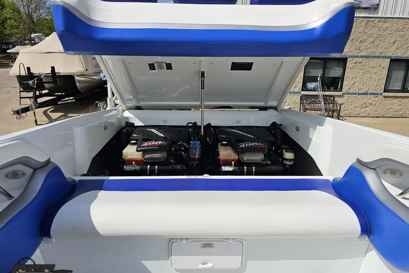 Slide: The Image of 2006 Baja 35 Outlaw boat engine compartment with twin 496 engines, open hatch view. - 78