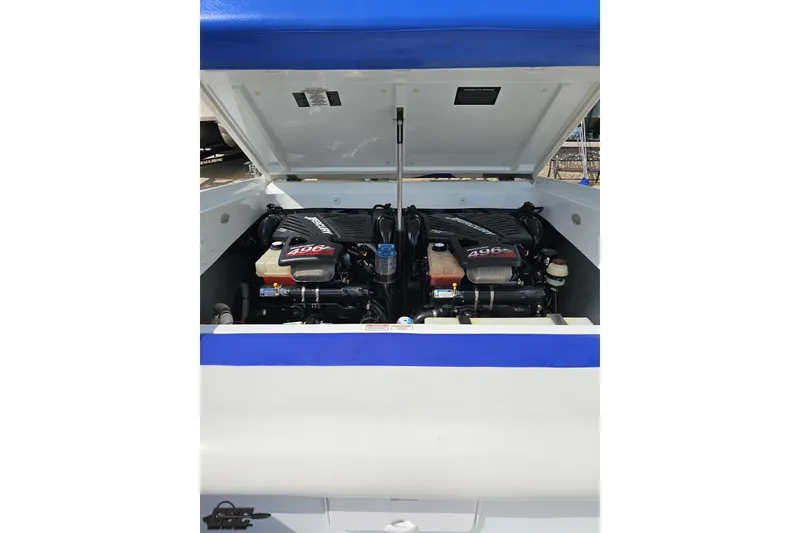 Slide: The Image of 2006 Baja 35 Outlaw boat engine compartment with twin 496 engines, open hatch view. - 79