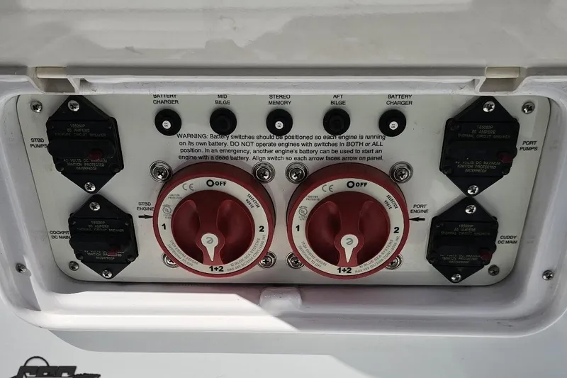 Slide: The Image of Control panel of a 2006 Baja 35 Outlaw boat with battery switches and circuit breakers. - 80