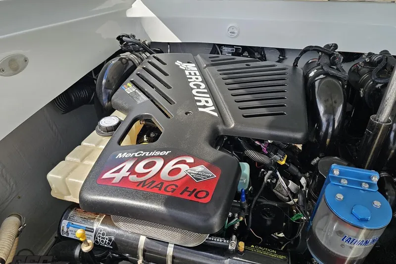 Slide: The Image of Engine of a 2006 Baja 35 Outlaw boat, featuring a MerCruiser 496 MAG HO. - 84