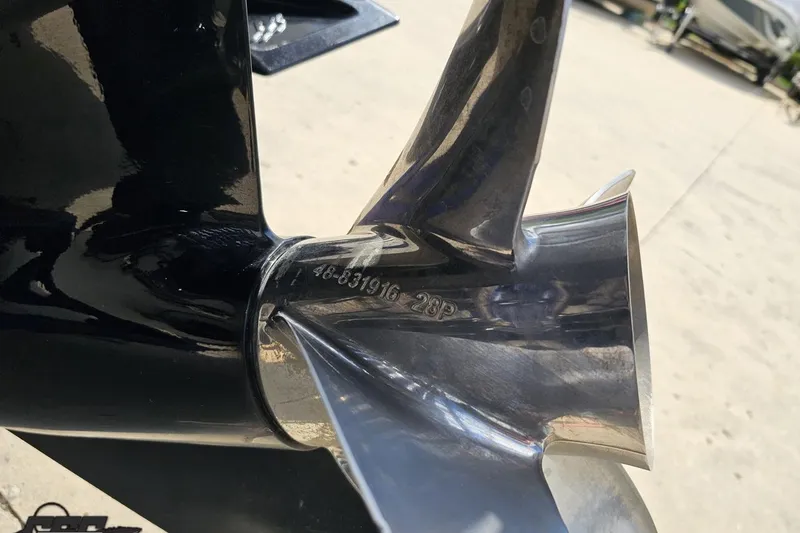 Slide: The Image of Close-up of a polished propeller on a 2006 Baja 35 Outlaw boat. - 89