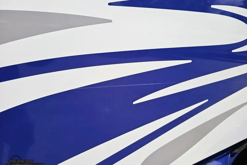 Slide: The Image of Blue and white graphic design on 2006 Baja 35 Outlaw boat. - 91