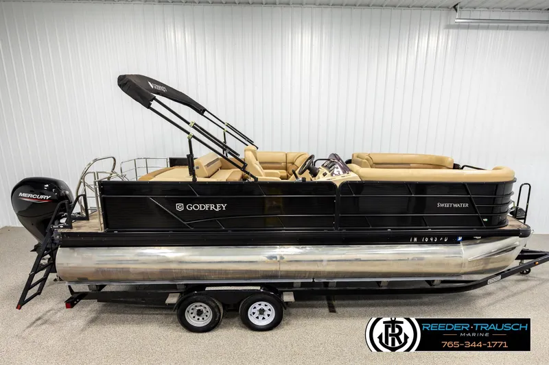 The Image of 2020 Godfrey 2286 RFL pontoon boat with Mercury engine on trailer. - 1