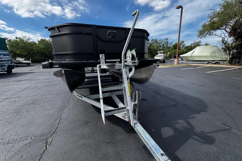 Slide: The Image of 2026 Princecraft Sportfisher 21-2S boat on trailer in parking lot. - 3