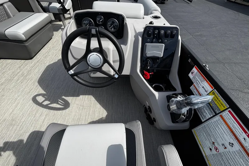 Slide: The Image of 2026 Princecraft Sportfisher 21-2S boat interior with steering wheel and control panel. - 5