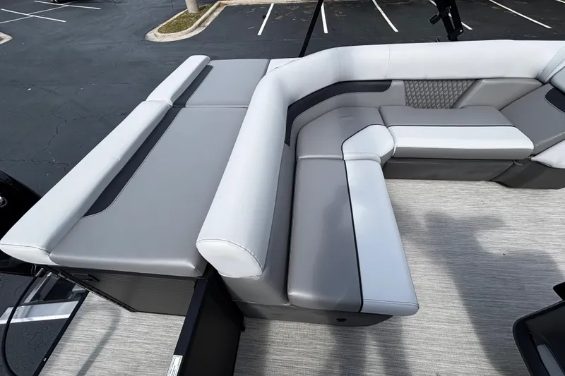 Slide: The Image of 2026 Princecraft Sportfisher 21-2S boat interior with gray cushioned seating. - 6