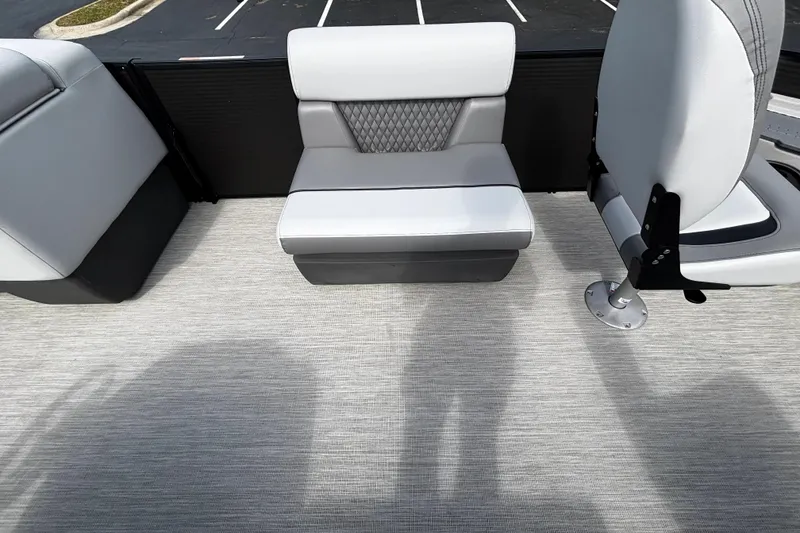 Slide: The Image of 2026 Princecraft Sportfisher 21-2S boat interior with gray seating and textured flooring. - 9