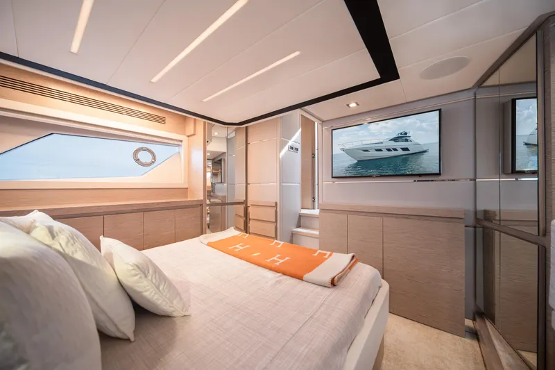 Slide: The Image of Luxurious 2019 Filippetti S55 yacht bedroom with modern decor and large window view. - 25