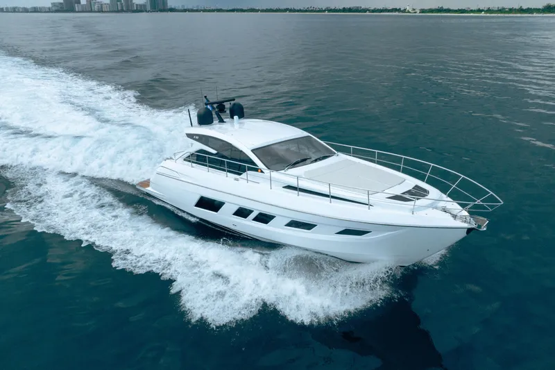 Slide: The Image of 2019 Filippetti S55 yacht cruising on open water, showcasing sleek design and performance. - 3