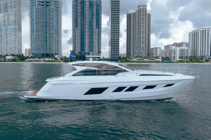 Slide: The Image of 2019 Filippetti S55 yacht cruising near modern city skyline. - 5