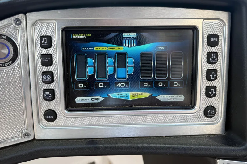 Slide: The Image of 2013 MasterCraft X-45 dashboard display showing ballast and tab controls. - 11