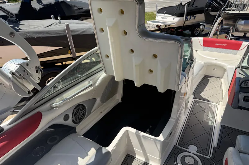 Slide: The Image of 2013 MasterCraft X-45 boat interior with seating and storage compartments. - 15