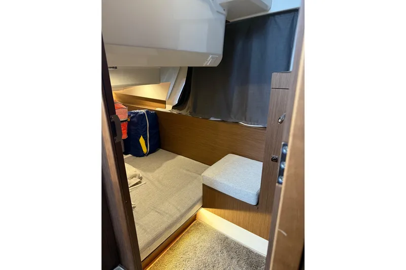 Slide: The Image of 2022 Jeanneau NC Weekender 1095 cabin interior with cozy seating and modern design. - 15