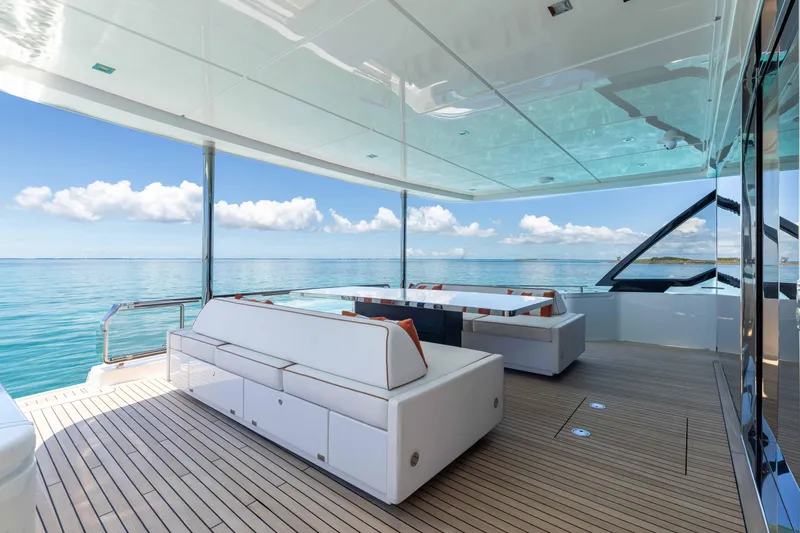 Slide: The Image of Luxurious 2020 Riva 90 Argo yacht deck with elegant seating and ocean view. - 14