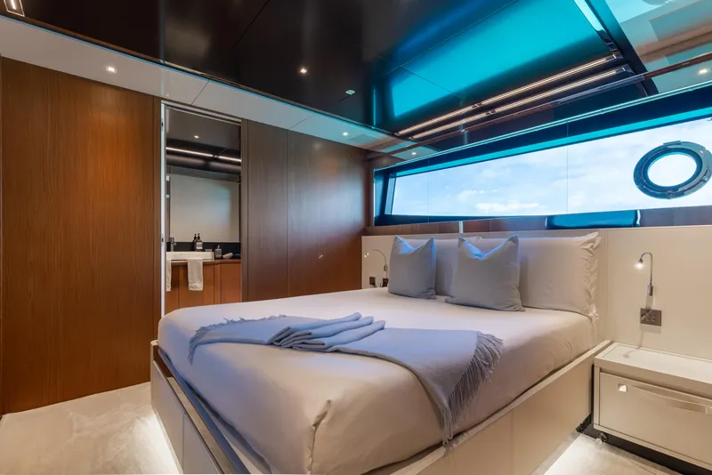 Slide: The Image of Luxurious bedroom interior of 2020 Riva 90 Argo yacht with modern design and large window. - 38